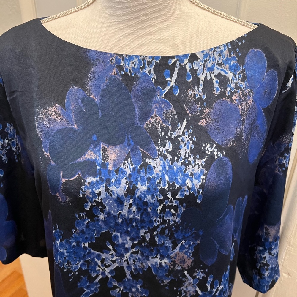 Unworn- Banana Republic blouse- Black with blue flowers. Short sleeves. Size XL